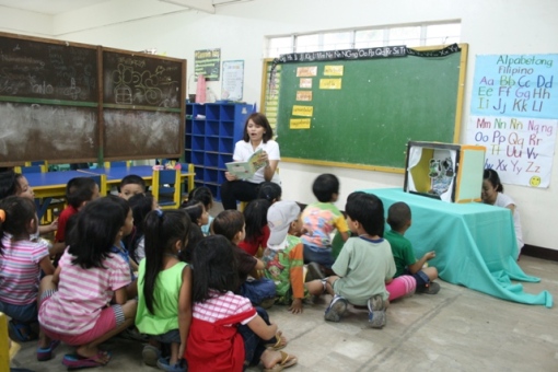Story telling time. The teachers at CHEERS are student-volunteers from the Child Development and Education program of Miriam College.